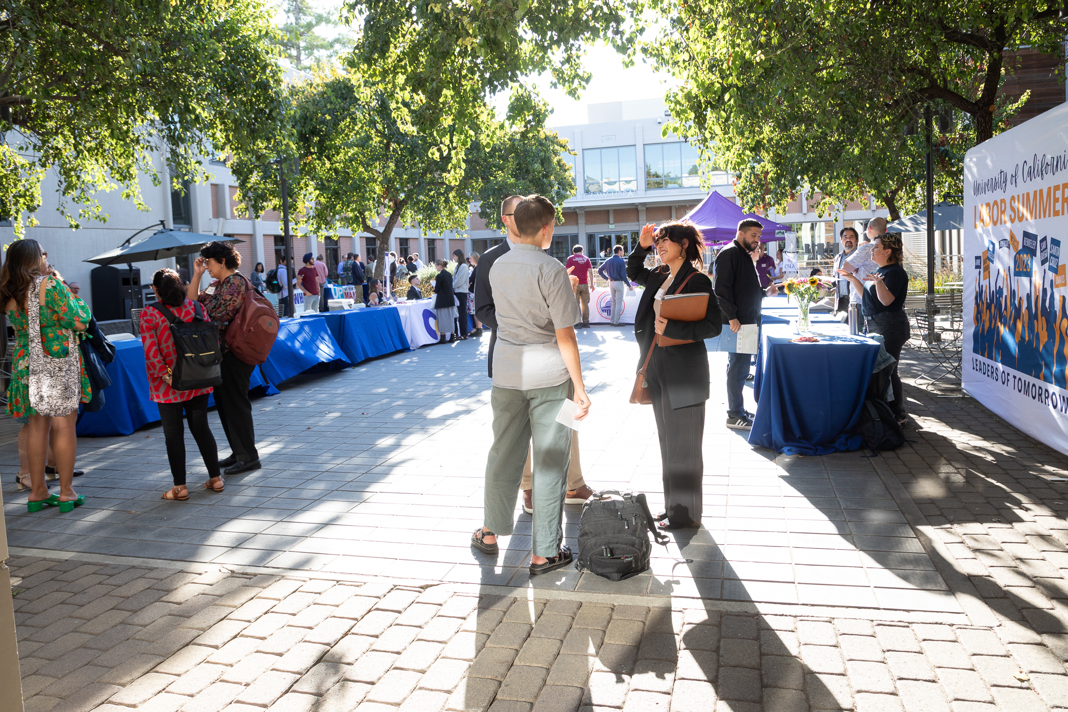 People mingling in the King Hall courtyard.