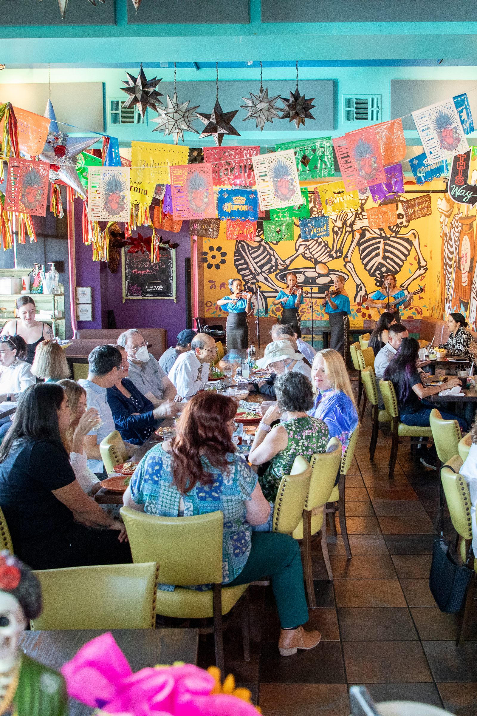 A mariachi performing on stage at Tres Hermanas.