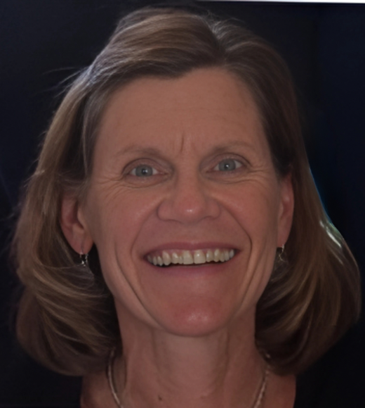 Nancy Coan Torres smiling brightly at the camera.