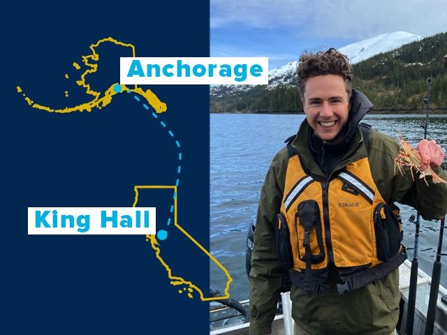 Nolan Gerlach '23 in an Alaskan boat with a blue hue to the left.