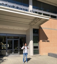 UC Davis Law student Banmit Bath standing in front of King Hall.