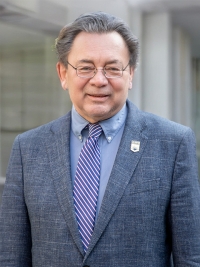 Dean Johnson in front of a building.