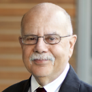 Close-up portrait of Professor Edward Imwinkelried wearing a suit and eyeglasses.